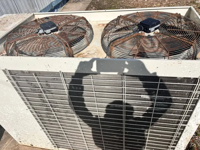Dusty package AC unit before a Haji AC deep-clean and service