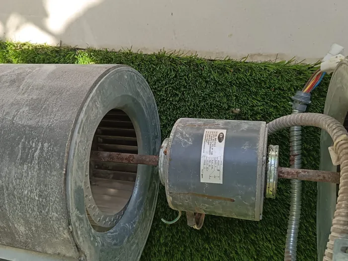 Blower motor removed for cleaning and bearing service