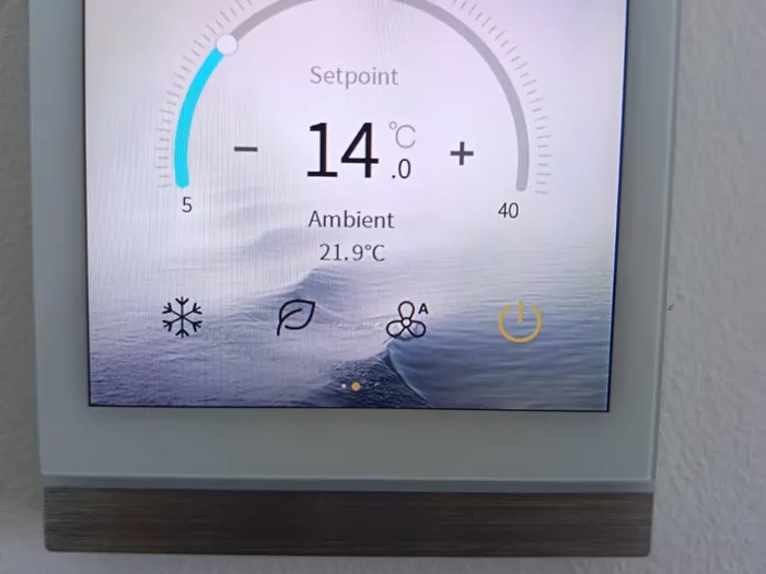Smart thermostat showing 14 degrees after a completed Haji AC repair